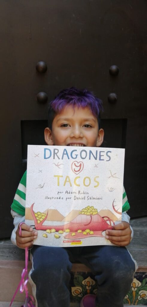 Smiling boy with a book
